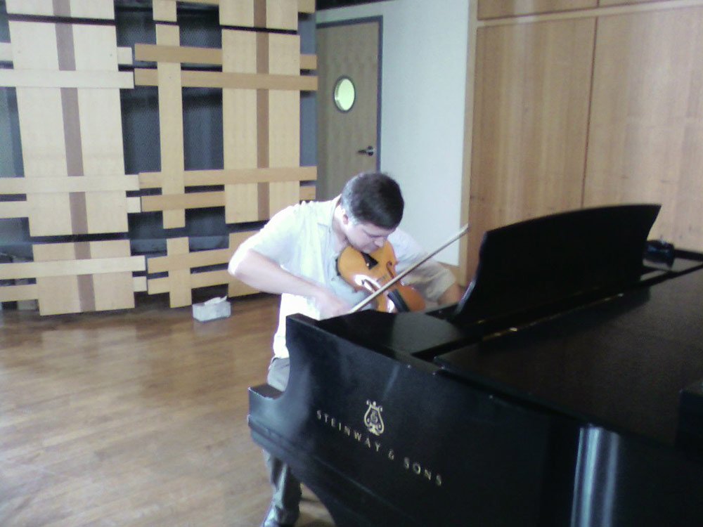 Eric Lawson tuning onstage at Rock Hall, Philadelphia, before a rehearsal of Mahle's music